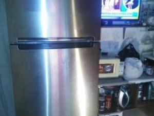 gray Whirlpool top-mount refrigerator